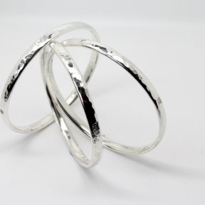 6mm oval heavy Planished Silver Bangle with feature hallmarks. One item supplied. 