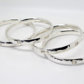 Handmade 8mm wide heavy Planished Silver oval Bangle with feature hallmarks - one supplied